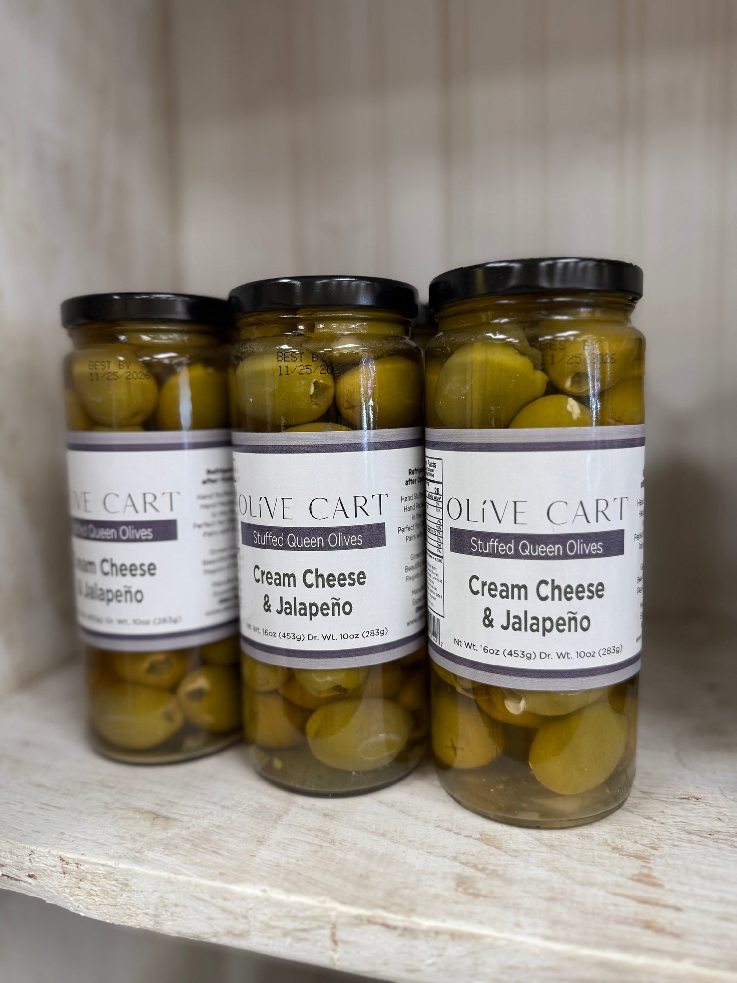 Three jars of Olive Carts Cream Cheese & Jalapeño stuffed olives