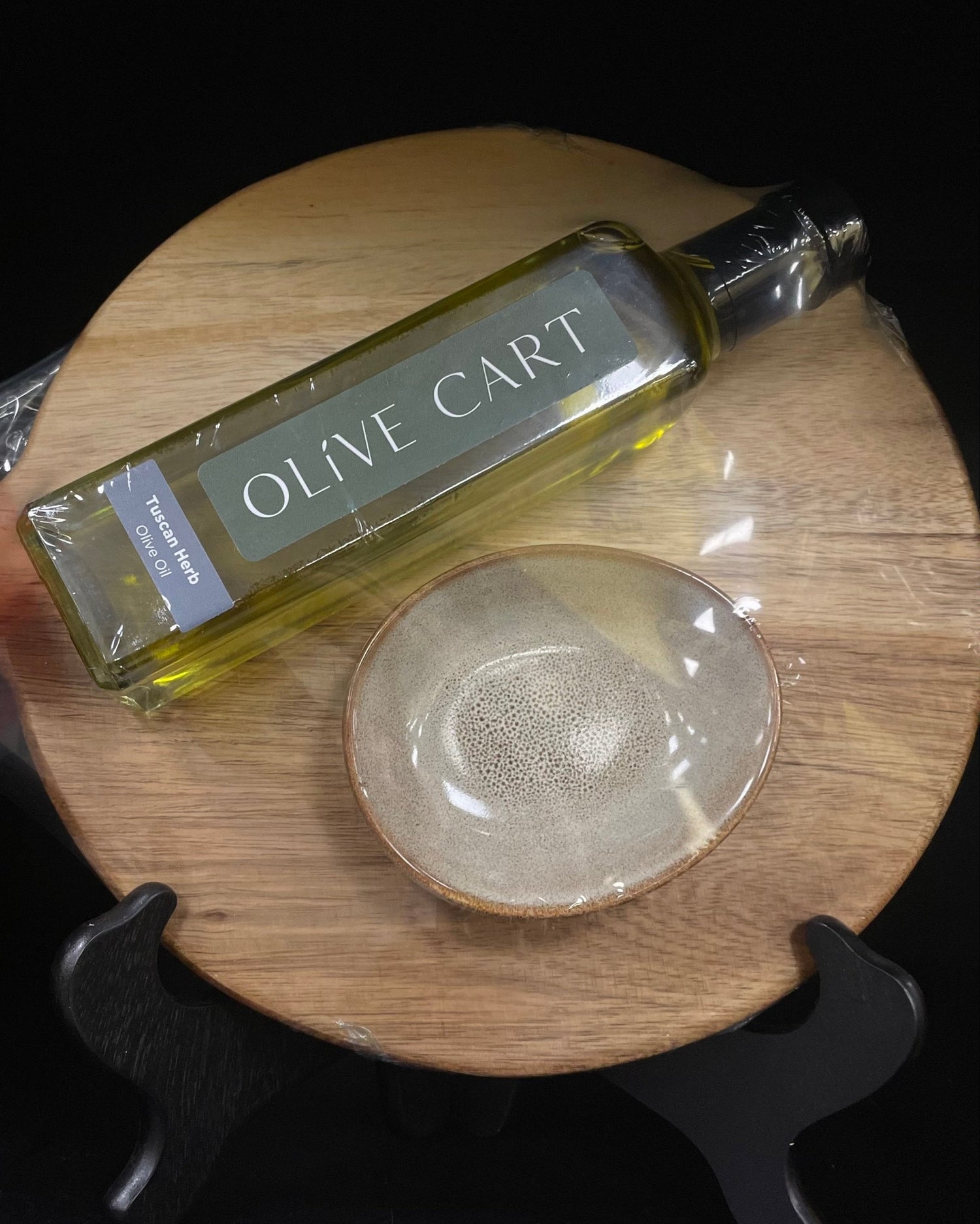Gift set of one bottle of Olive Cart's Tuscan Herb olive oil, dipping bowl, and round wooden board